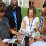 students and staff peruse the new books