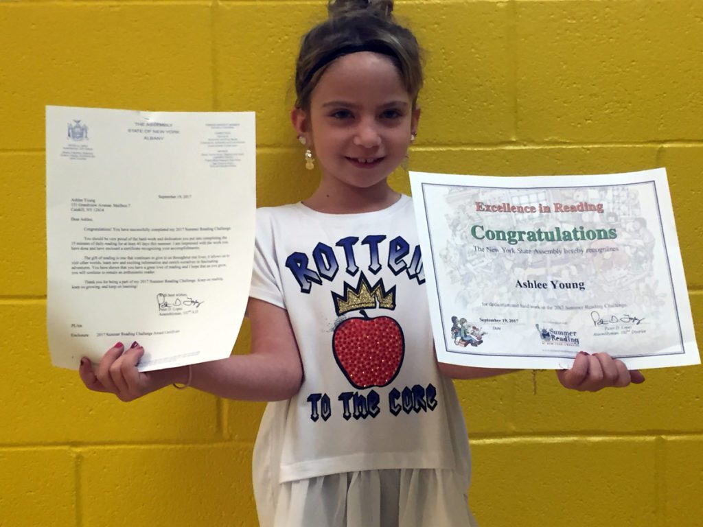 Ashlee Young with congratulatory certificate and letter from assemblyman Pete Lopez