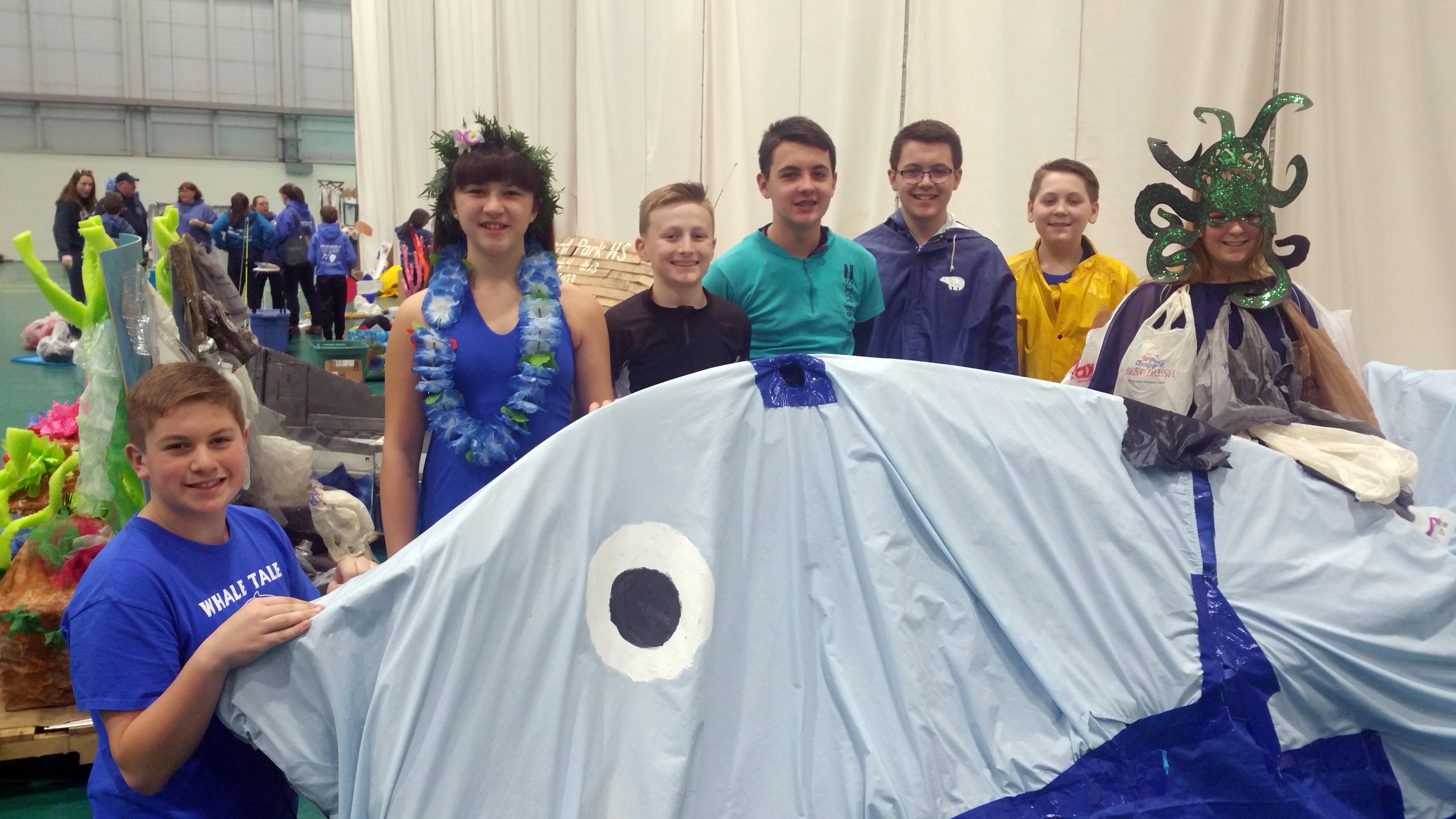 team whale tale poses with thier creation at state odyssey of the mind