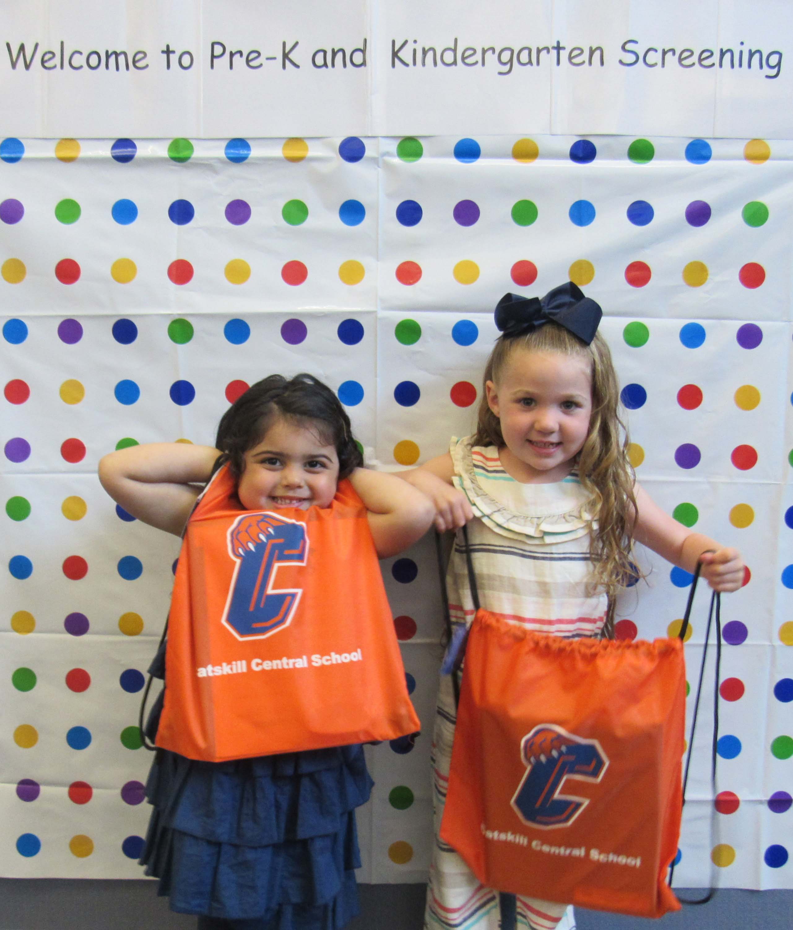two girls holding Catskill CSD bags