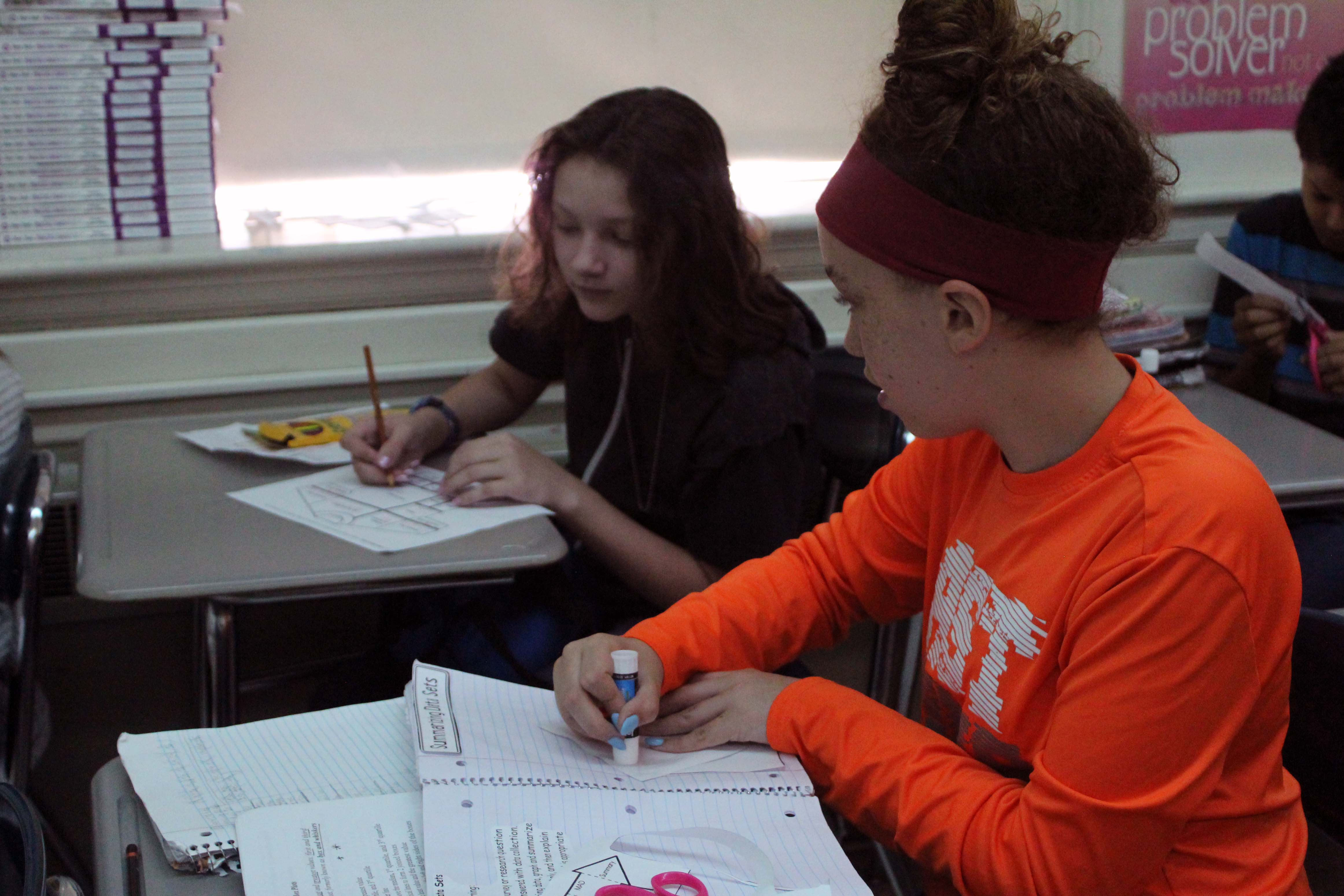 two girls doing classwork