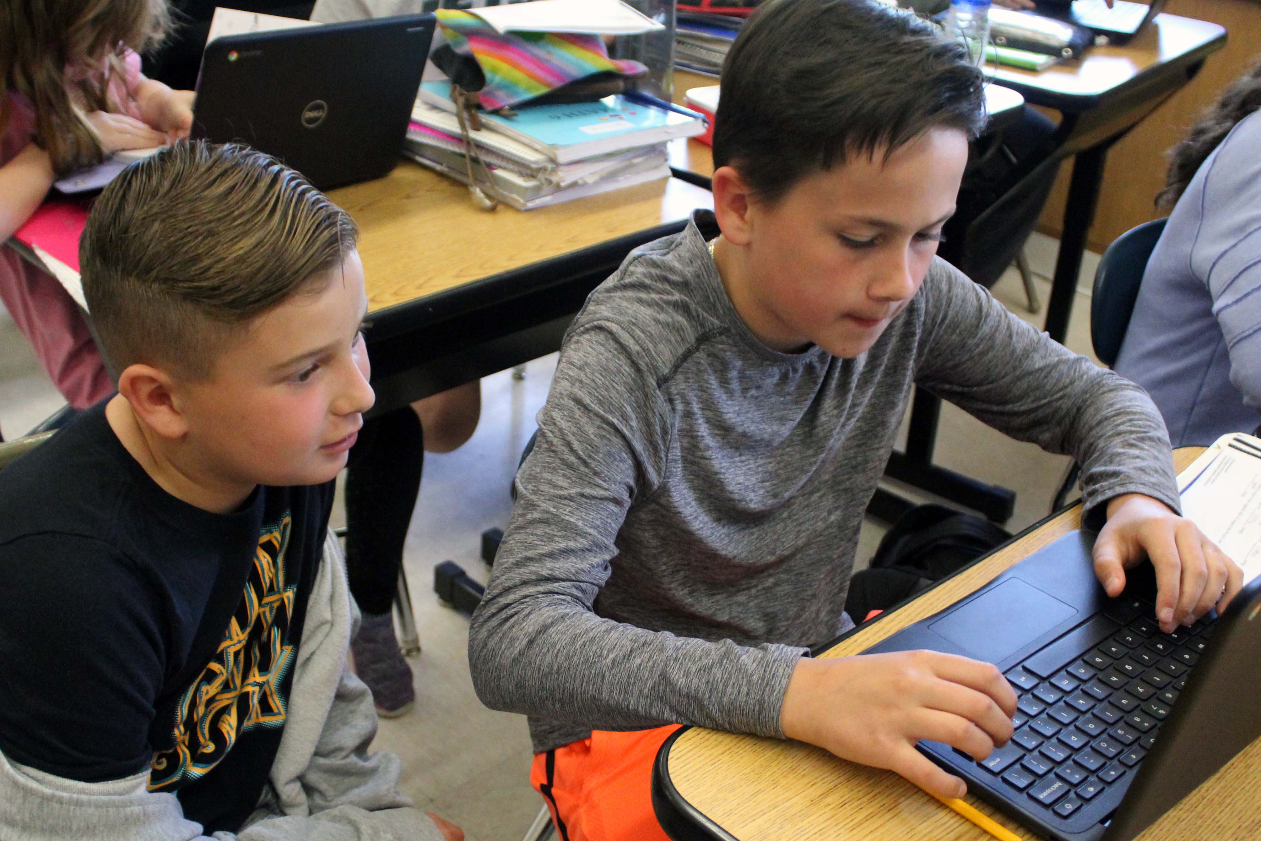 two boys doing classwork