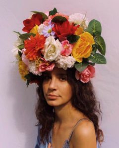 Joanna Van Slyke wearing large flower hat