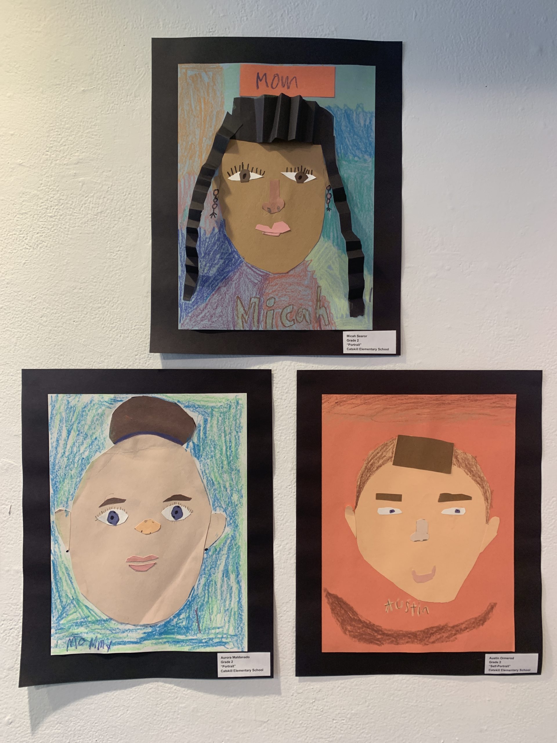 student artwork on gallery wall
