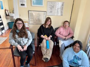 students sitting in chairs inside Hudson-Athens Lighthouse