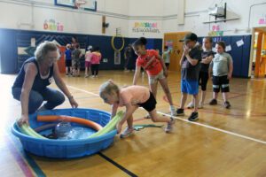 students playing with kidde pools