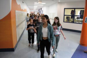 students exploring hallway