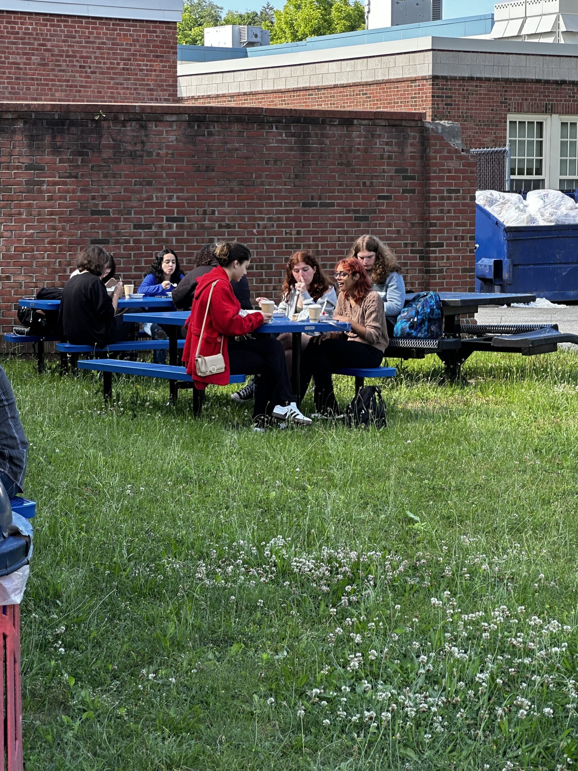 students eating ice cream at outdoor tables