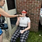 blindfolded girl tasting ice cream