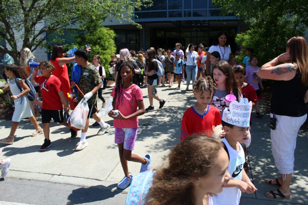 students exiting elementary school