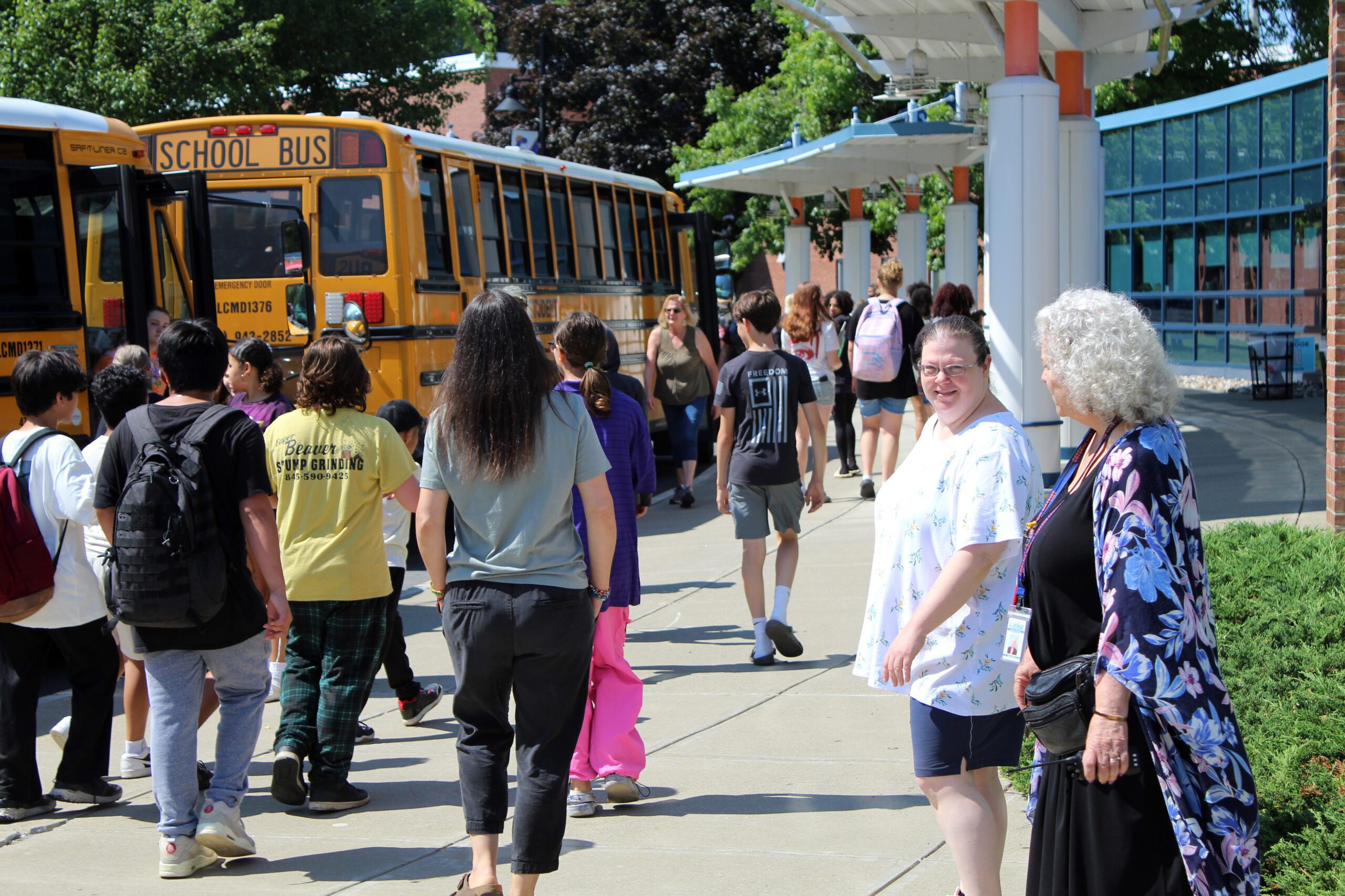 students boarding buses at secondary campus