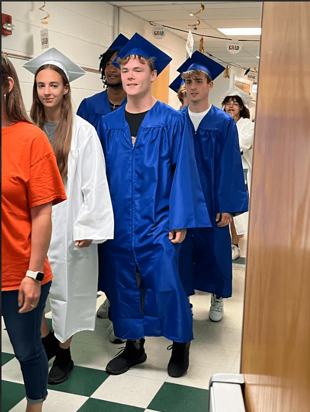seniors walk through CES hallway