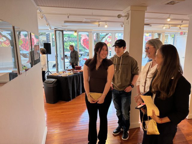 crowd looking at paintings