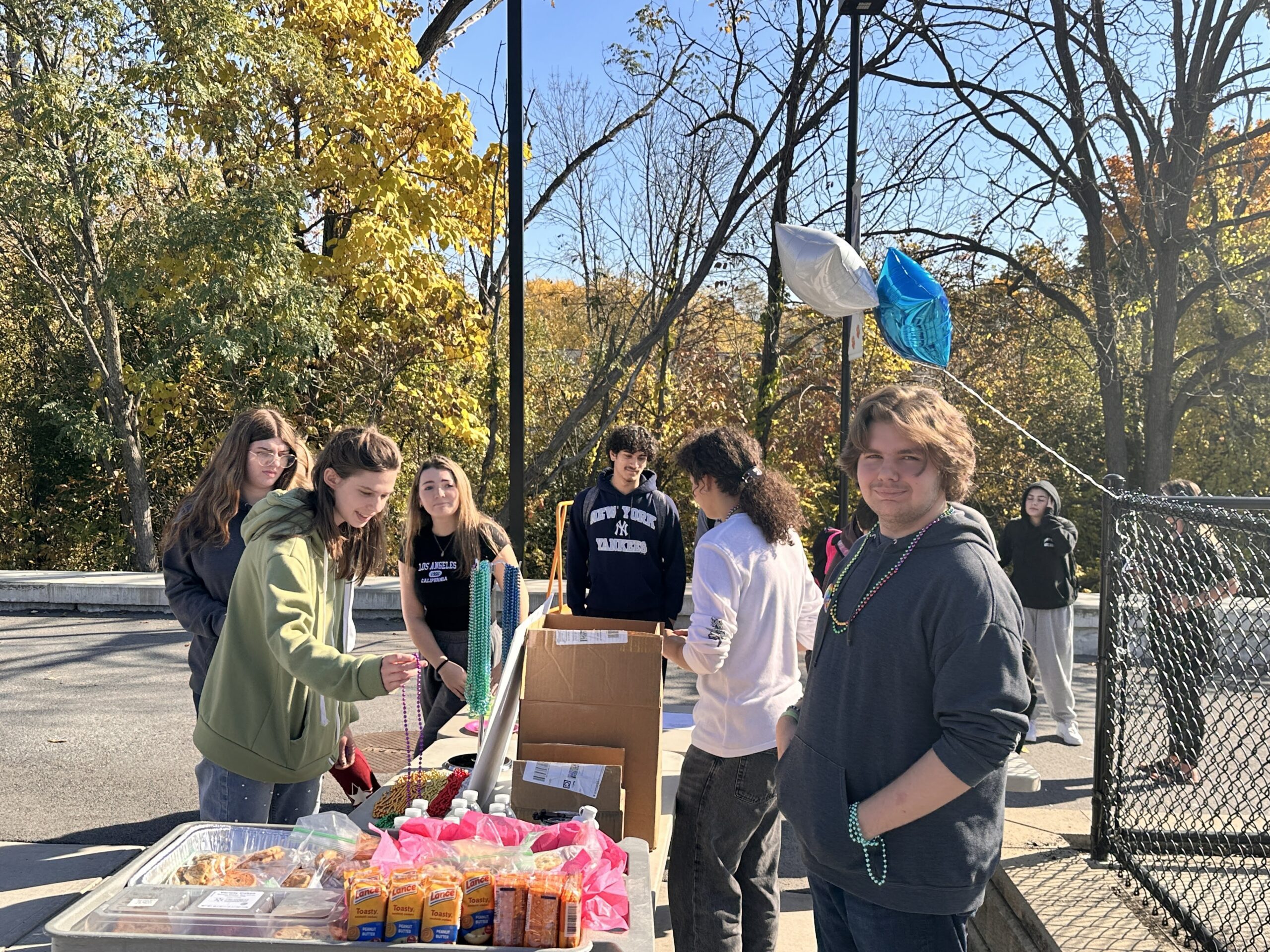 students check out information booth