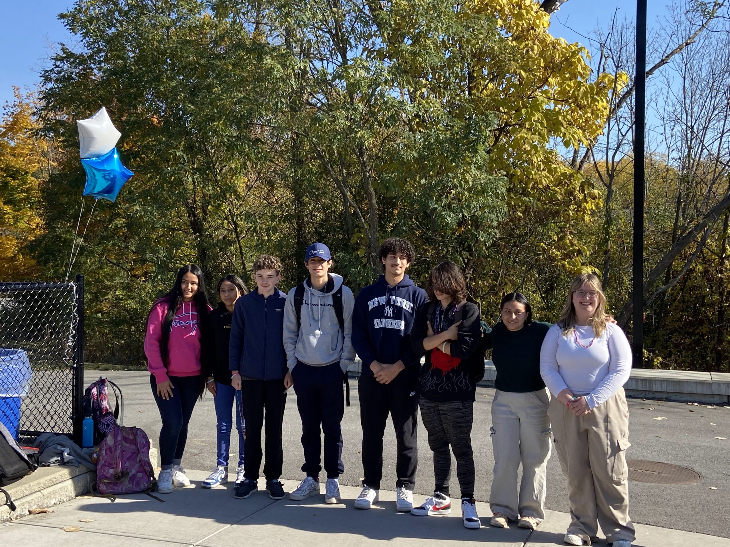 students posing for photo at track