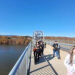 students walking on bridge