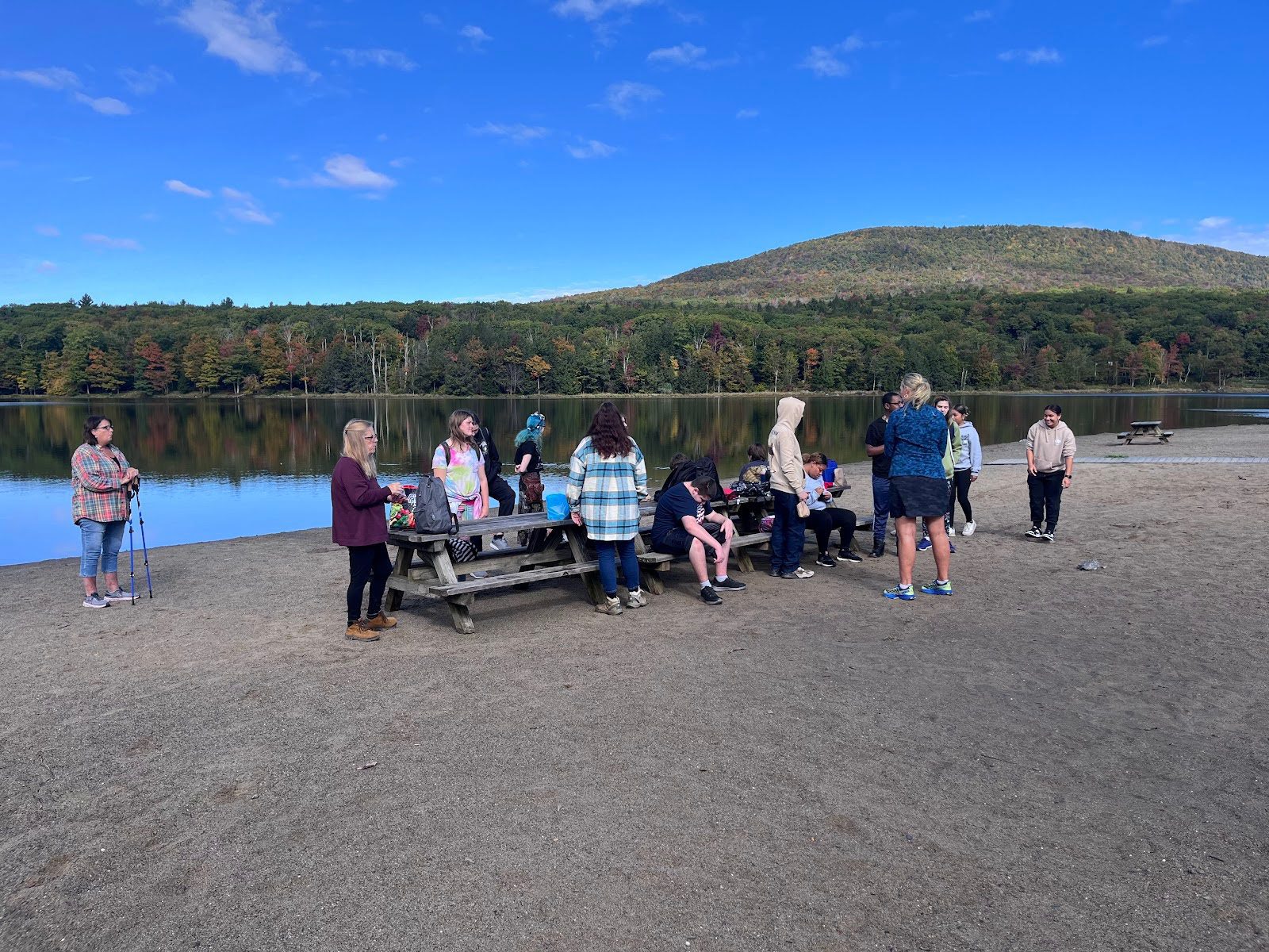 class picnicking on lake shore