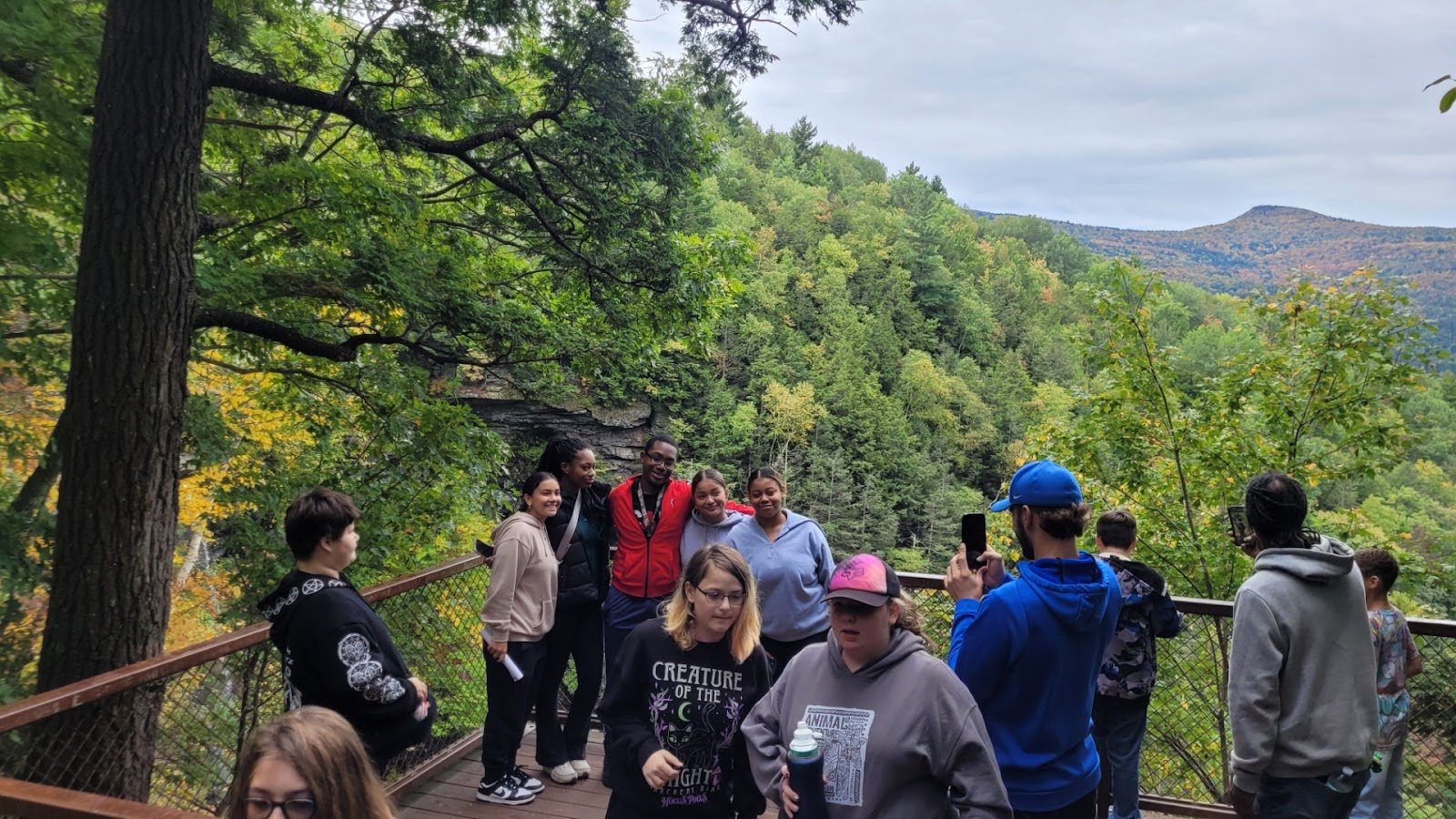 students near waterfall