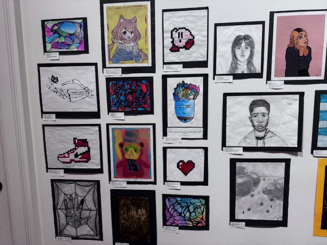 student artwork on gallery wall