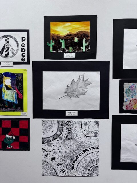 student artwork on gallery wall