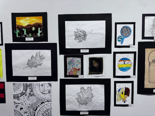 student artwork on gallery wall