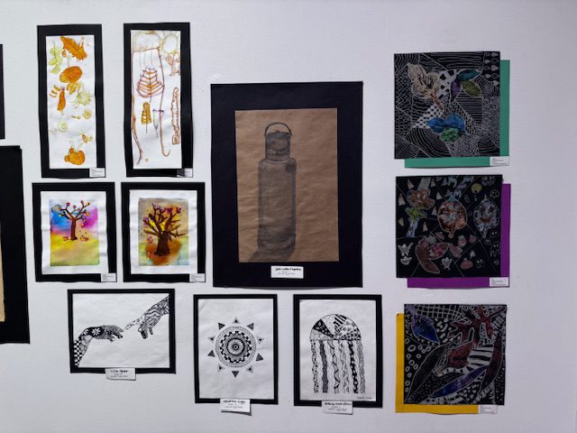 student artwork on gallery wall