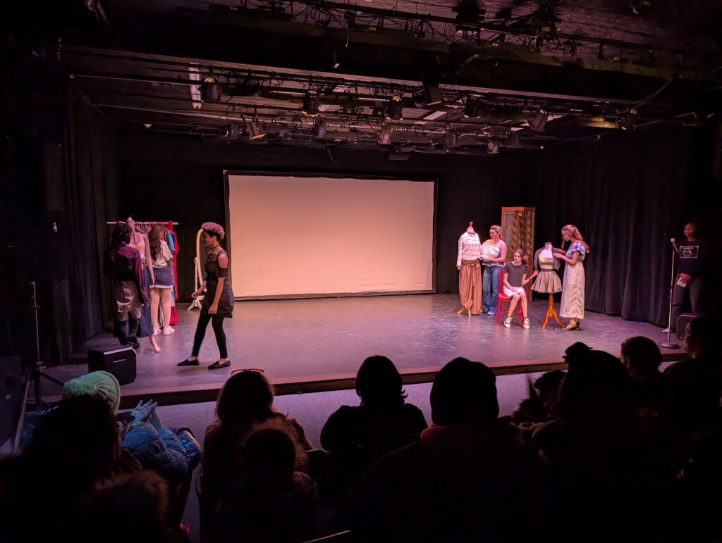 students on runway stage