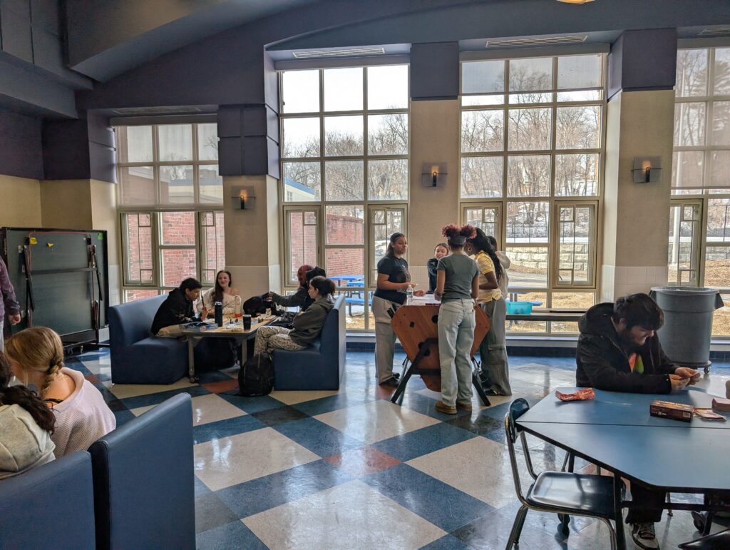 students using lounge chairs and table game
