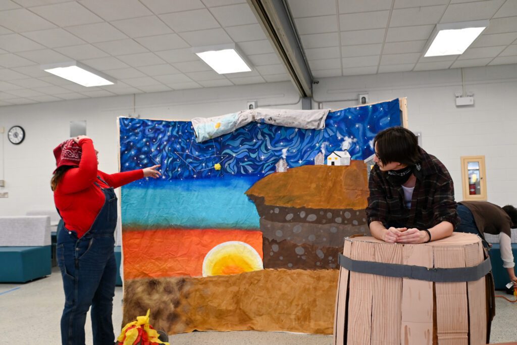 students acting out play