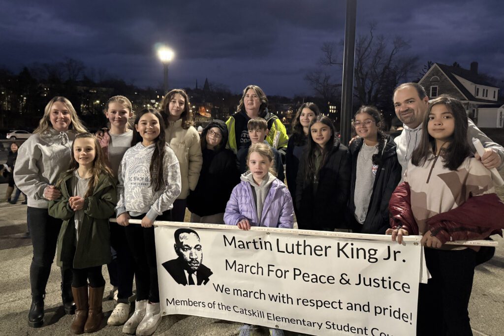students holding Martin Luther King Jr. banner