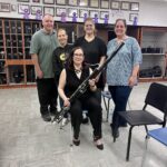 Group of adults holding bassoon