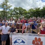 Students from CES Student Council, CES Business Club, and CMS Business Club on parade float.