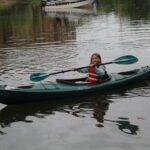 girl in kayak on water