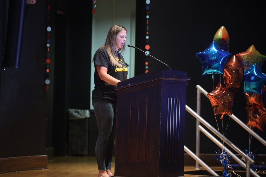 woman speaking at podium