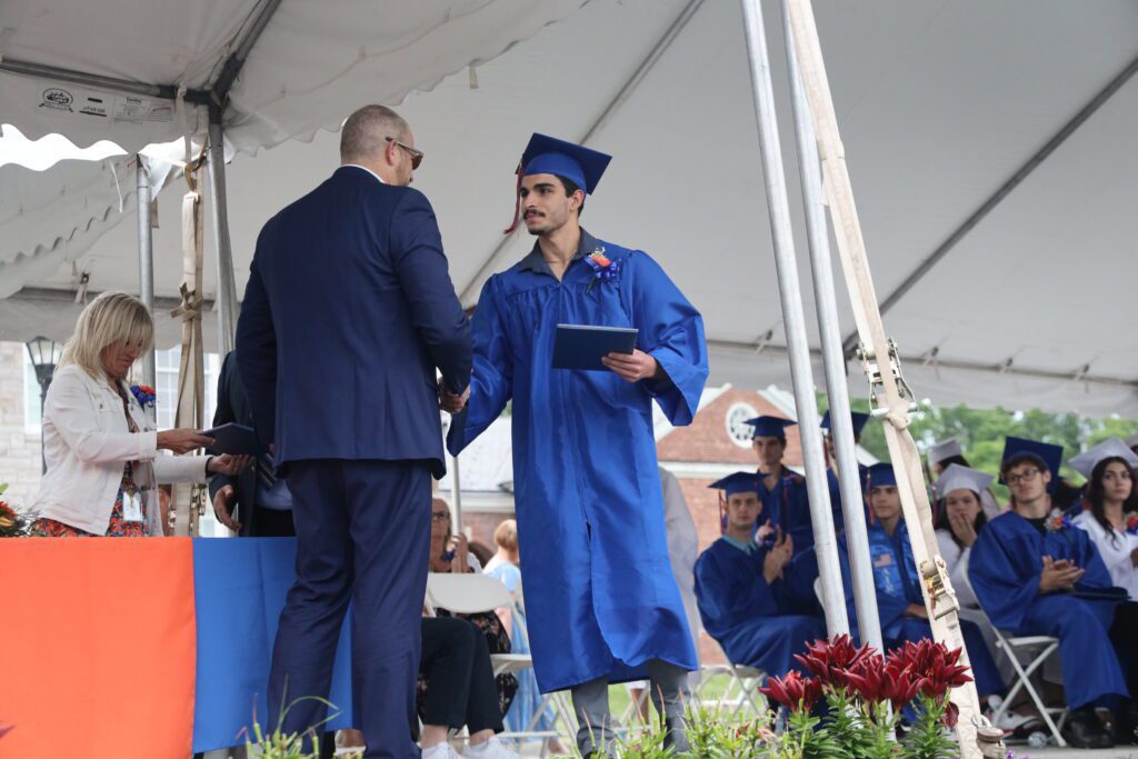 graduate shaking hands with superintendent