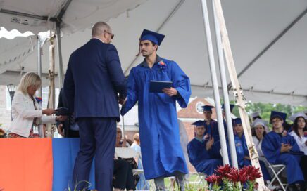 graduate shaking hands with superintendent