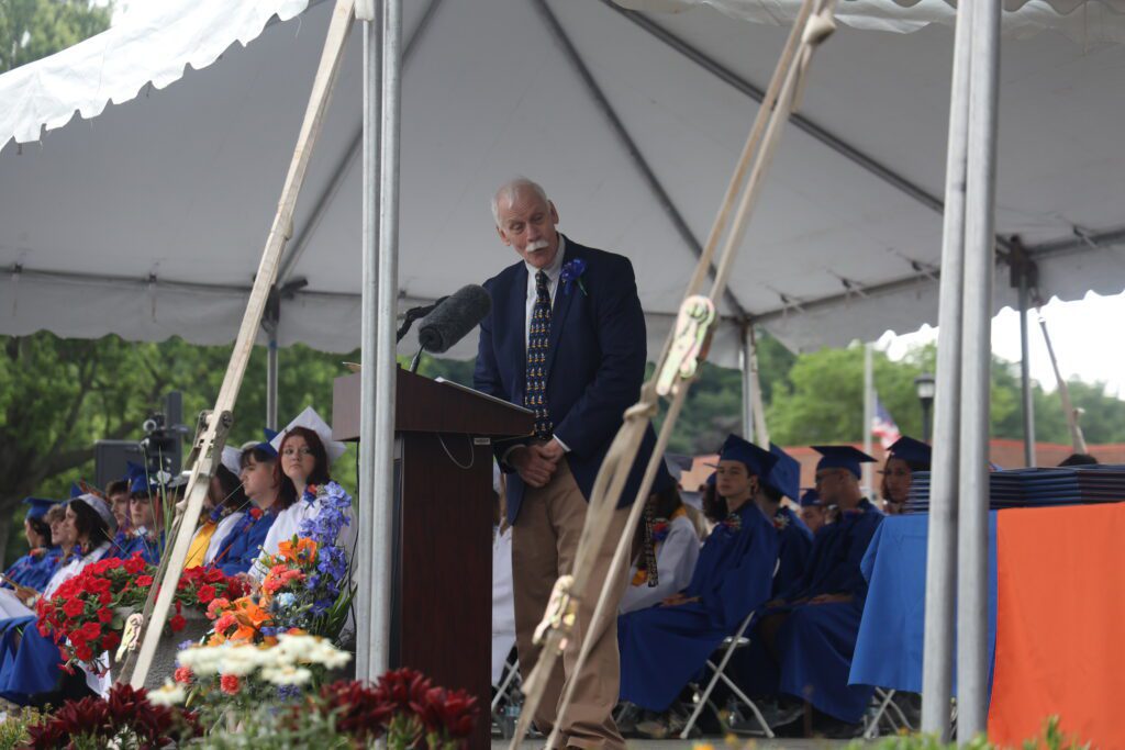 Principal Martin talking at podium