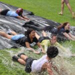 group of students sliding on waterslide