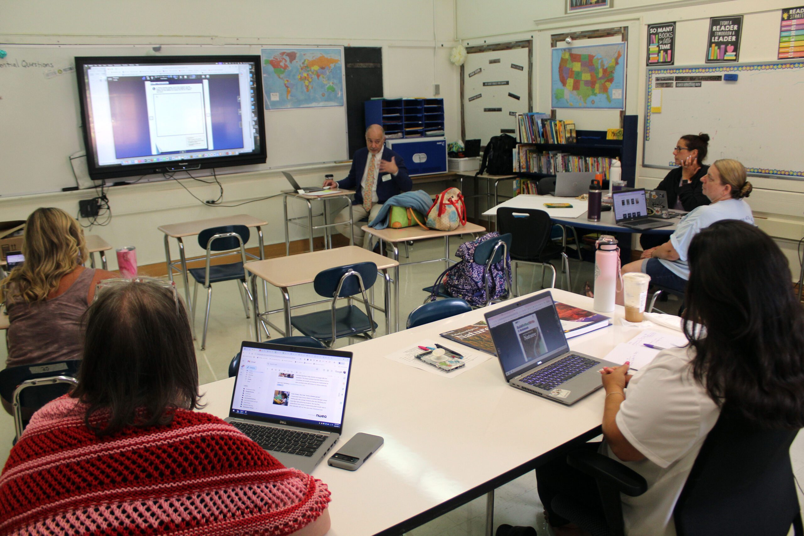 man giving presentation to faculty in classroom