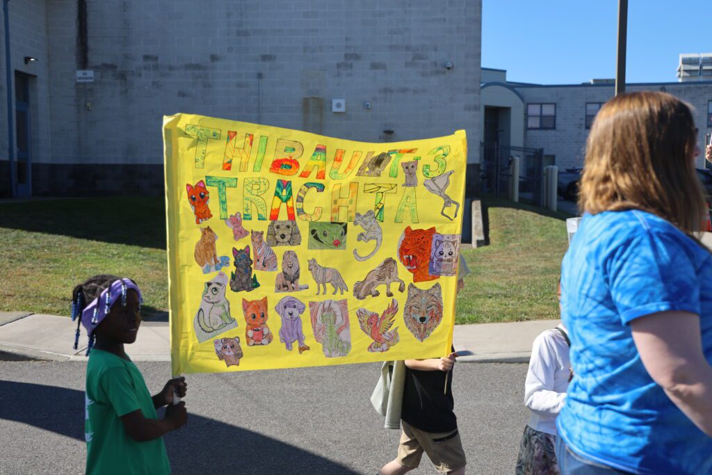 students holding banner