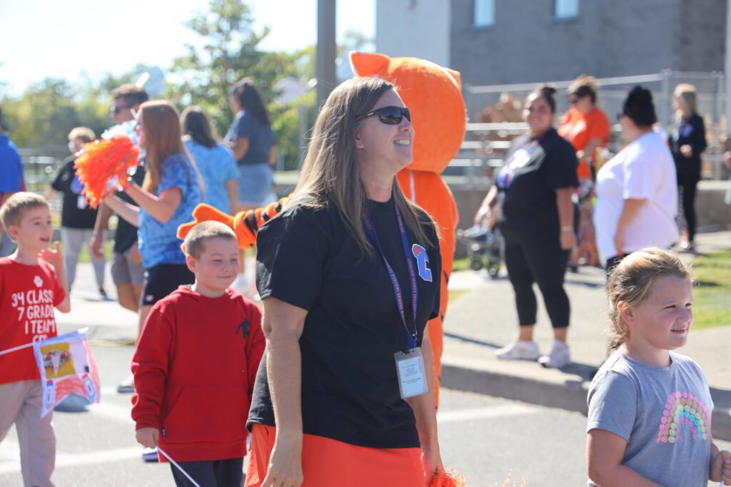 teacher and students parading