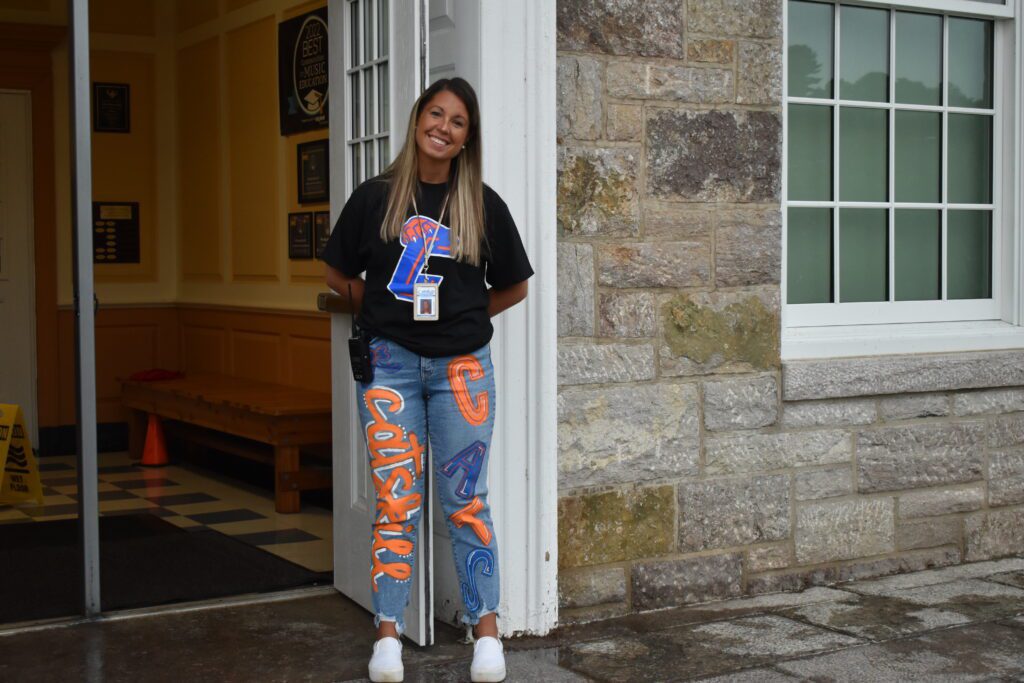 student wearing Catskill shirts