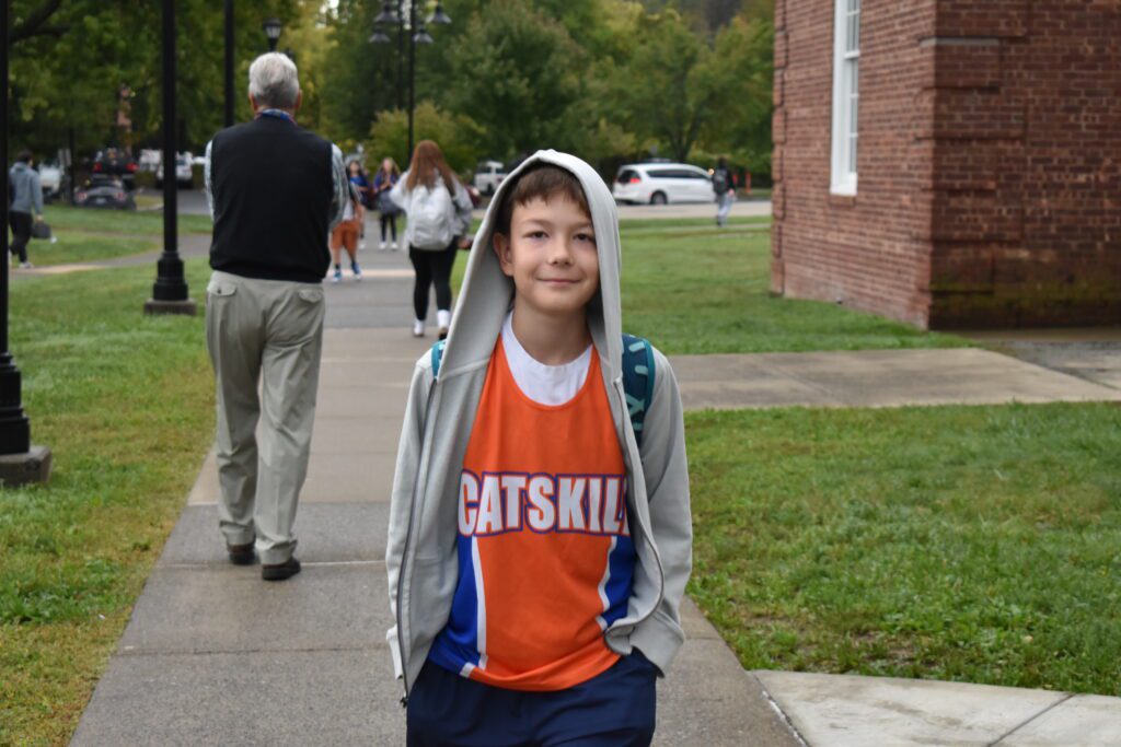 student wearing Catskill shirts