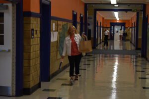 teacher walking down hallway
