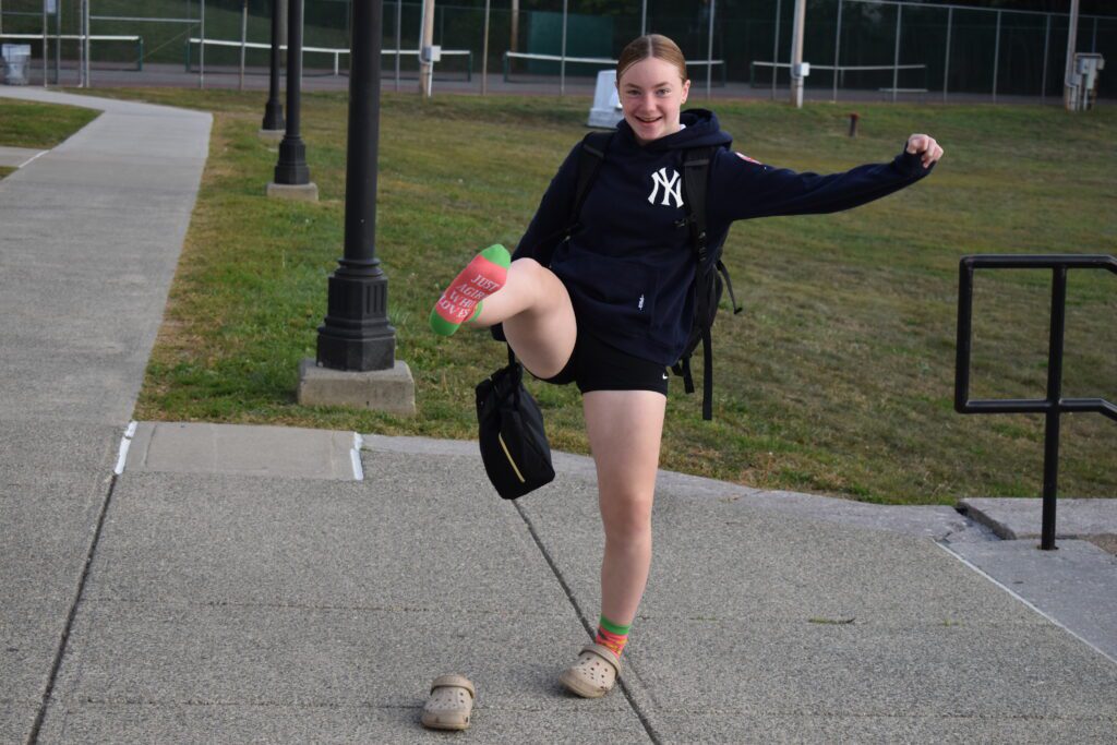 girl holding up foot with crazy sock on it