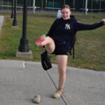 girl holding up foot with crazy sock on it