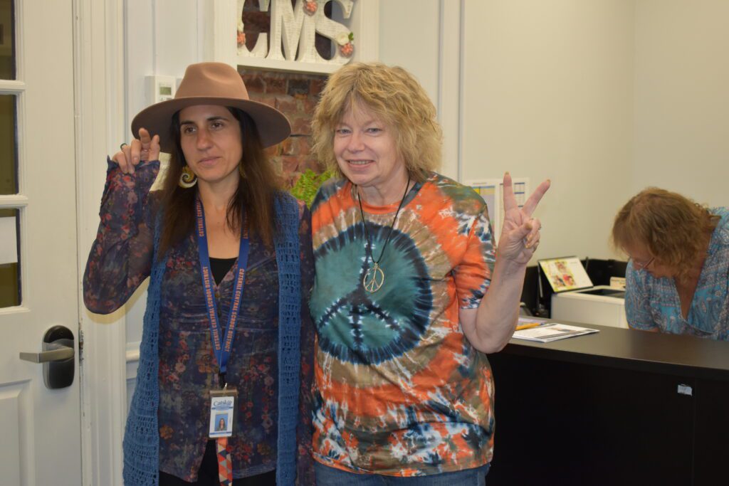 two women dressed in seventies style clothing