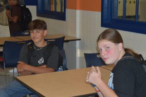 two boys sitting at table