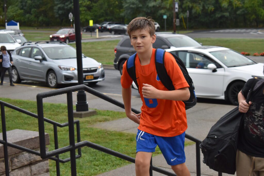 student wearing Catskill shirts