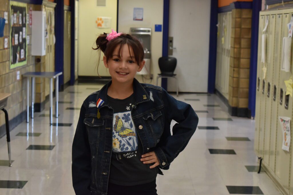 girl dressed in seventies style clothing